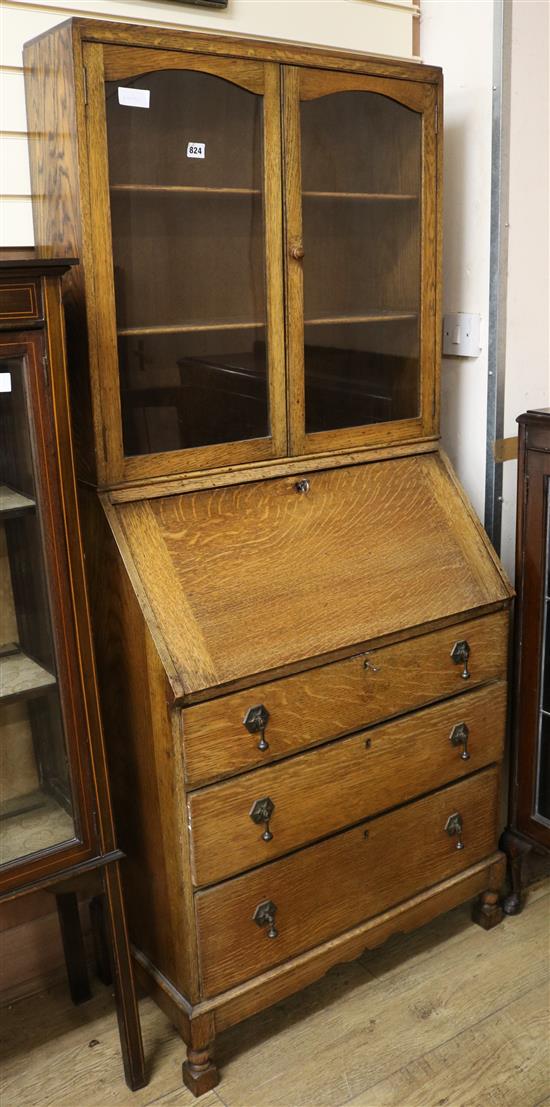 A 1920s oak bureau bookcase W.74cm